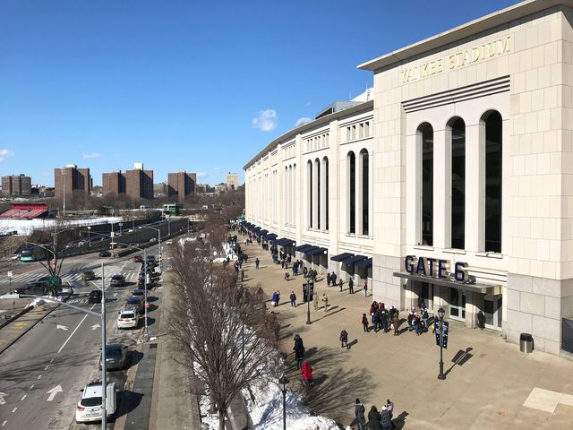 People wait in line for a COVID-19 vaccine at the Yankee Stadium vaccination site in the Bronx on February 6th, 2021.